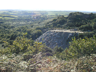 A spoil heap of quarried granite.